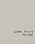 Text 'Kusama Obsession Off White' on a textured off-white background in St. Albert